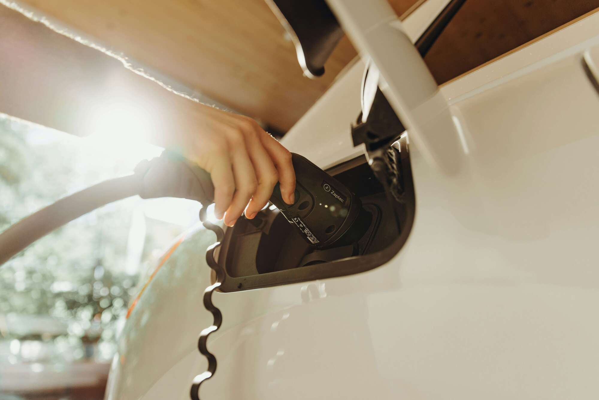 Home EV Charger Hand charging a car Gravity Electric Calgary